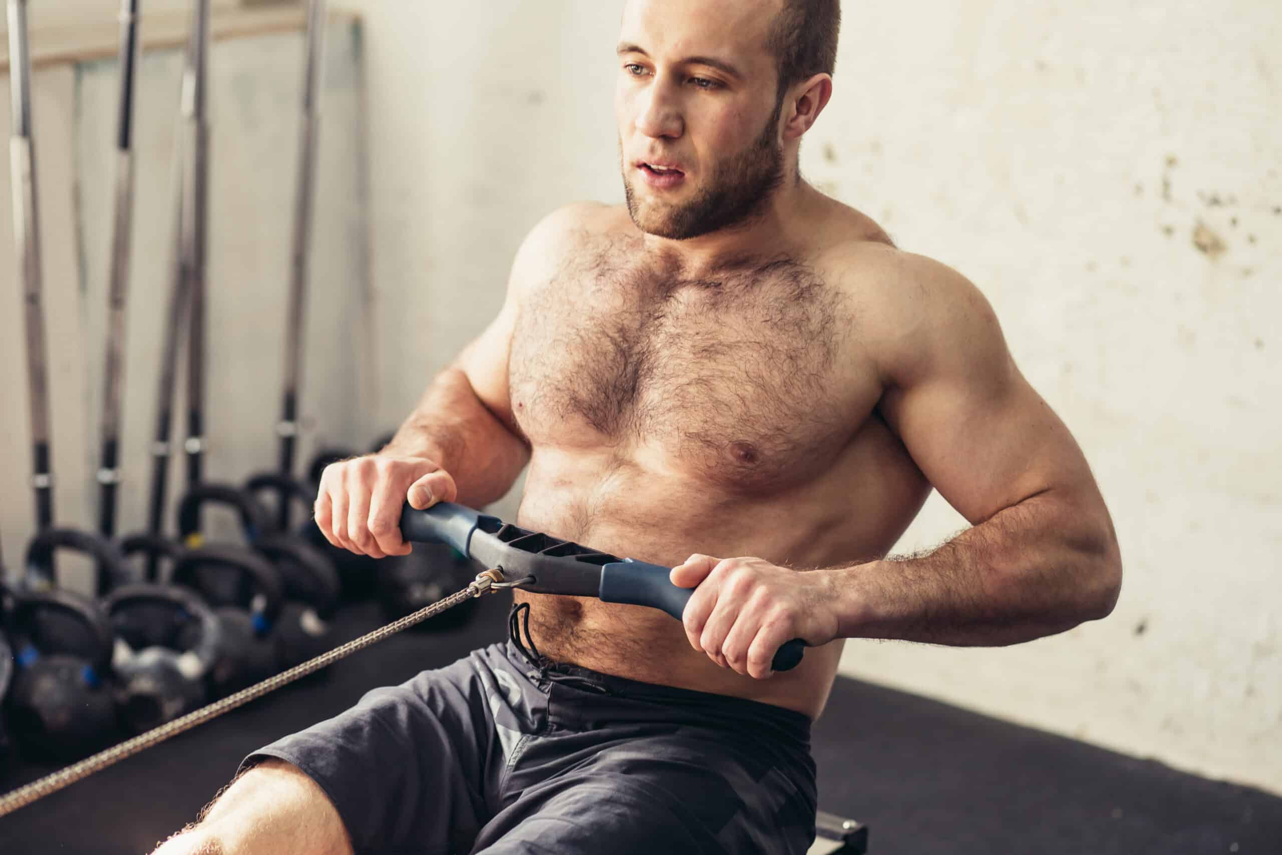 man using rowing machine