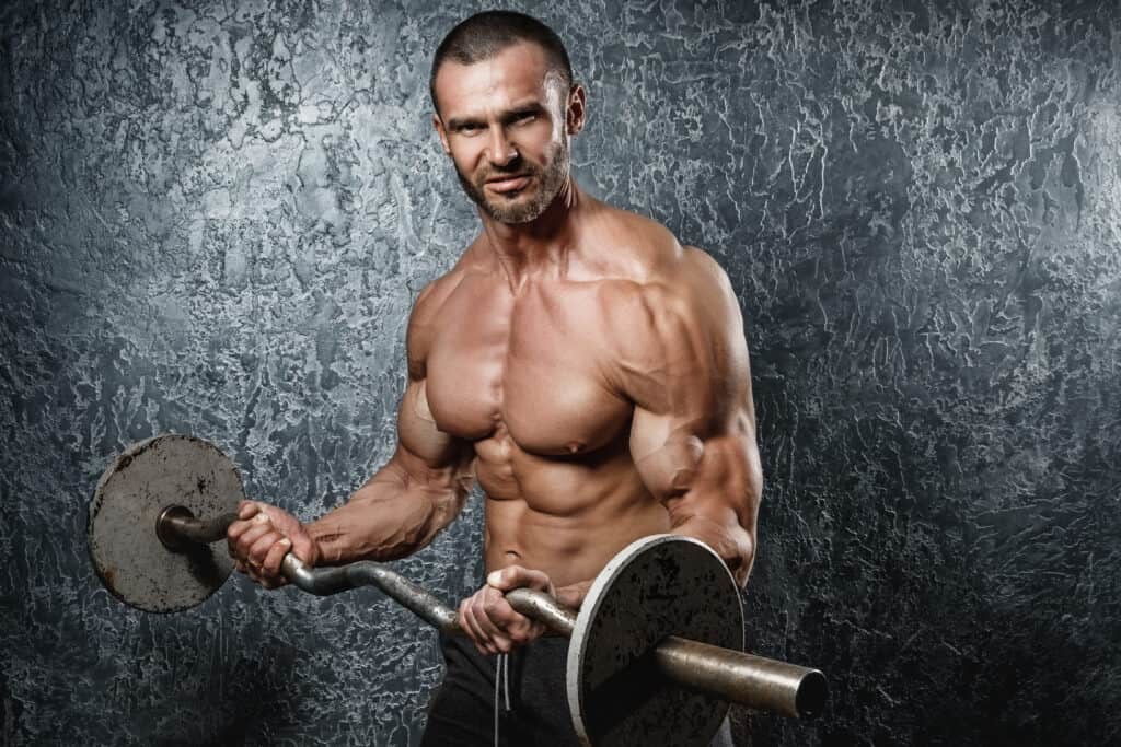 man exercising with barbell