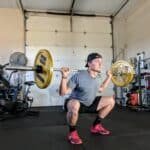 man working out in garage gym