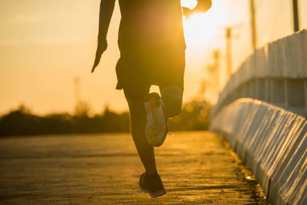 man running during sunrise